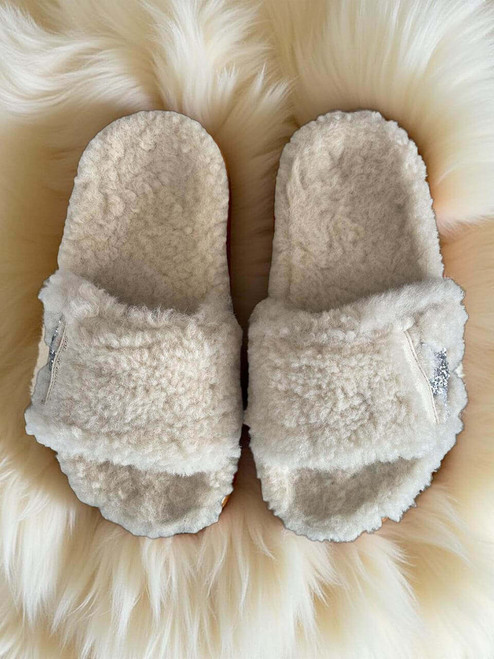Golden Goose Shearling Slides front view of pair in creamy ivory shearling with silver glitter star detail