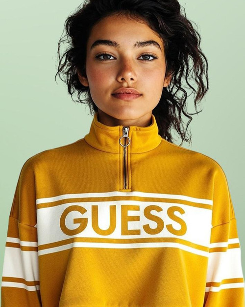 Guess Yellow Logo Crop Sweater front view on model with half zip, white chest banner with yellow Guess logo