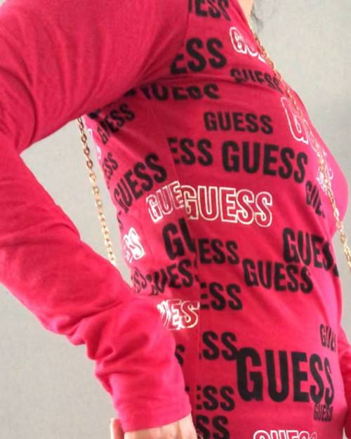 Guess Pink Long Sleeve Logo Top side view in bright pink with black & white GUESS logos across the side