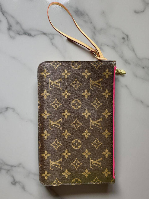 Louis Vuitton Neverfull Monogram Pochette front view with LV monogram canvas, pink zip trim, and leather wrist strap
