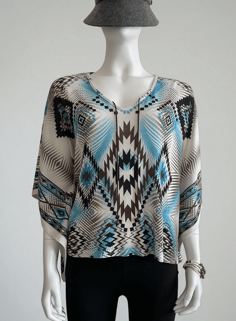 News Geometric Pattern Poncho full front in relaxed fit, wide sleeves, white base & aztec-style print in brown & blues