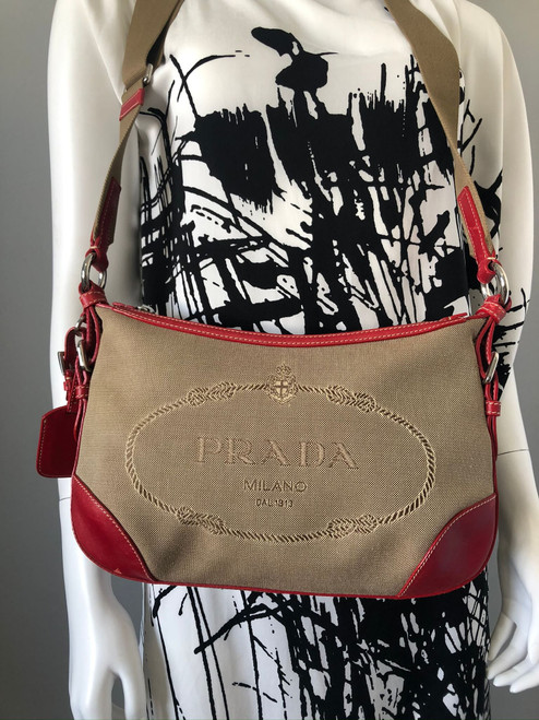 Prada Canapa Canvas Crossbody Bag close up front showing structure of the bag & embroidered Prada Milano logo