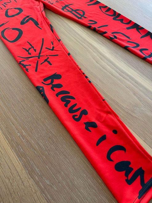 Graffiti Slogan High-Waisted Leggings Flat lay side closeup in red highlighting black bold graffiti like text prints