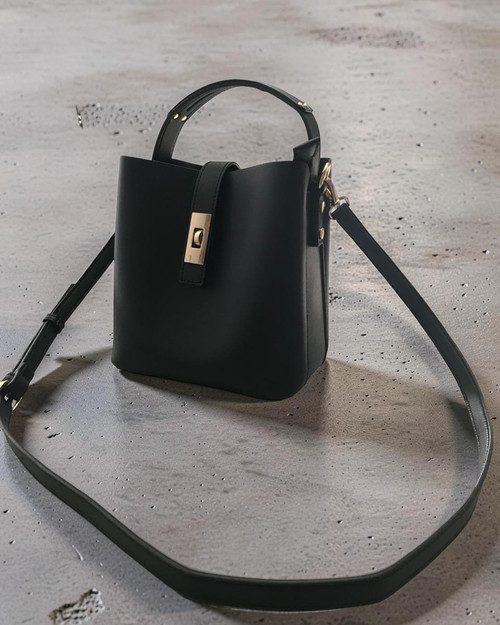 Woolworths Black Crossbody Twist Lock Bucket Bag - angled view showing top handle, gold hardware & detachable strap
