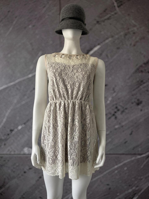 Cream Lace Cut Out Sleeveless Mini Dress full front view with lace overlay, cut-out neck, elastic waist & brown lining