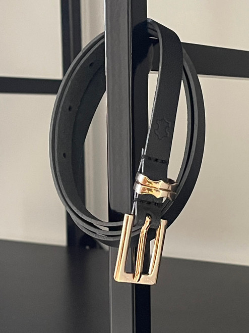 Woolworths Studio Black Leather Skinny Belt hanging view showing leather logo, belt holes & shiny gold hardware
