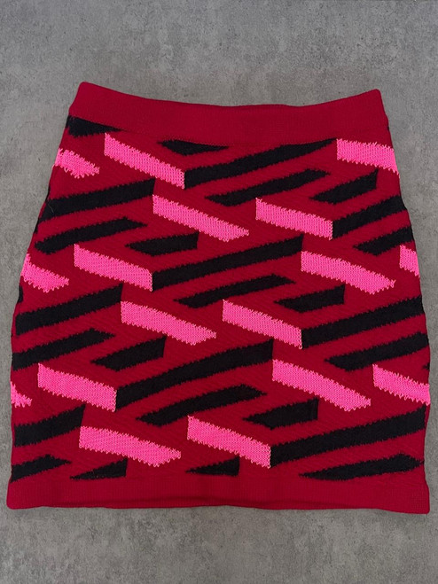 Versace Red La Greca Knit Mini Skirt front flay lay with red base, hem & waist and black & bright pink La Greca print