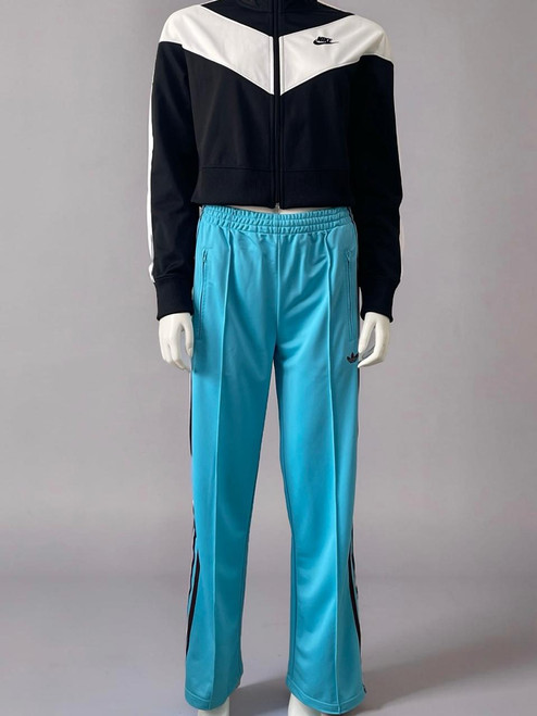Adidas Blue Firebird Track Pants front on mannequin with elastic waist, side zips pockets, black 3 stripes & trefoil logo
