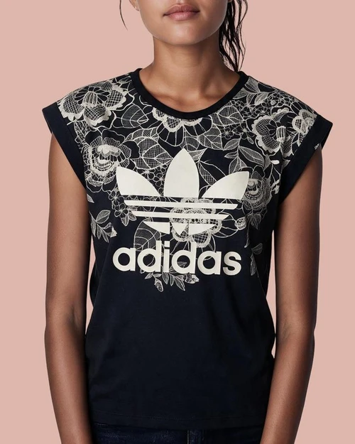 Adidas Originals Florido Charcoal Grey T-Shirt front view on model with upper body white floral print & Trefoil logo adidas