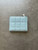 Colette Hayman Baby Blue Bi-Fold Purse back showing quilted panels & silver tone zip compartment