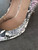 Aldo Snake Print High Heels – right heel inner lining showing storage-related peeling on inner right side