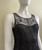 Armani Exchange Black Lace Mini Dress angled front closeup of sheer lace neckline & black lining with floral overlay