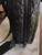 Armani Exchange Black A|X Embossed Backpack side view showing black zip closure & zip pull & A|X embossed logos