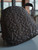 Armani Exchange Black A|X Embossed Backpack front view with black base & AX embossed logos covering the front