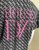 Diane Von Furstenberg Grey Print T-Shirt closer back view showing light surface cracking on pink House of DVF” logo