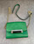 Diane Von Furstenberg Green Crossbody Mini Bag closer front showing gold & black rectangle snap close