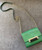 Diane Von Furstenberg Green Crossbody Micro Mini Bag top front view with faux croc flap, gold chain strap with leather support