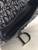 Christian Dior Black Monogram Saddle Bag flap open showing black interior & zip pocket with silver D