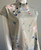 Emery Rose Grey Floral Mandarin Collar Blouse angled side showing collar button detail, short sleeves & pink & blue florals