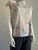 Emery Rose Grey Floral Mandarin Collar Blouse angled side view showing collar 3 black button detail and capped short sleeves