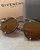 Givenchy Brown Tinted Aviator sunglasses flat lay showing tinted lenses, black frame with gold-tone brow bar