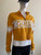 Guess Yellow Half-Zip Crop Logo Sweater Side angle showing long sleeves, cropped length & relaxed fit in mustard & white
