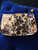 Jimmy Choo Graffiti Clutch front view front view showing multicolour graffiti-style print, stars & bold gold nameplate