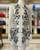 Karen Millen White Embroidered Cutout Mini Dress front in white base & lining, with black floral detailing on the sides