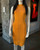 Karen Millen Orange Bandage Bodycon front view in sleeveless & high collar fit, silver stud panel & mini length