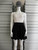 Khaos Monochrome Crochet Mini Dress Front with white sleeveless crochet bodice & black flared mini skirt