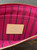 Louis Vuitton Neverfull Monogram Pochette interior in Pivoine pink lining with black stripes & embossed Louis Vuitton label