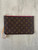 Louis Vuitton Neverfull Monogram Pochette front view in brown with all-over monogram print& gold zip & leather wristlet