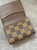 Louis Vuitton Damier Ebene Canvas Card Holder flap open showing card slots, textured interior with brown leather lining