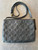 Louis Vuitton Black Monogram Empreinte Crossbody Bag back view with full embossed Monogram leather & shoulder strap