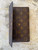 Louis Vuitton Monogram Trifold Wallet flap raised showing brown leather & monogram canvas & snap button