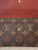 Louis Vuitton Monogram Trifold Wallet front view flap open showing brown canvas & LOUIS VUITTON PARIS made in France