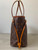 Louis Vuitton Monogram Canvas Neverfull PM left side with signs of discoloration on drawstring & leather piping