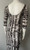 Ly Snake Print Bodycon Midi Dress back angled view with low scoop neck, stretch finish, 3/4 sleeves & bold print
