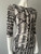 Ly Snake Print Bodycon Midi Dress close-up front showing fitted shape & bold black & white snake print