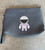 Max&Co Space Pop Collection Navy Clutch front view with with lavender & white astronaut motif & removable wrist strap