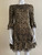 Michael Kors Metallic Gold Lace Mini Dress zoomed view of lower half with black & gold lace detailing & layered hem ruffles