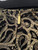 Michael Kors Gold Metallic Lace Mini Dress closeup back view of gold Michael Kors zip pull & hidden zip with textured lace