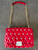 Michael Kors Red Leather Crossbody Bag front flat lay with chain doubled showing red leather shoulder support