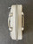 Michael Kors White Elliot Messenger Bag top view with silver zip track, textured finish & back slip pocket