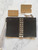 Michael Kors Collection Black Calf Leather Clutch back with white contrast stitching & wristlet strap in protective packaging