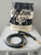 Moschino Monochrome Bucket Bag front view with black & white MOSCHINO MILANO COUTURE, wristlet & crossbody strap