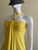 Pinko Yellow Halter Neck Top - side-angle with pleated neckline & silver tone hardware above bust connecting the halter neck