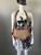 Prada Canapa Canvas Crossbody Bag worn on mannequin with brown canvas body & strap showing red trim details & silver hardware