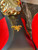 Prada Mary Jane Red Satin Heels view of under sole arch with elevated gold Prada logo, gold heels & unworn condition