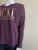Woolworths RE: Denim LOCAL Slogan Burgundy Sweater close up side view with dropped shoulder & ribbed long sleeve
